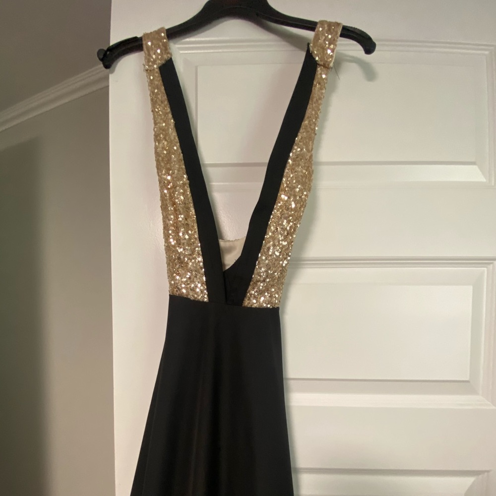 Black and gold sequin party dress